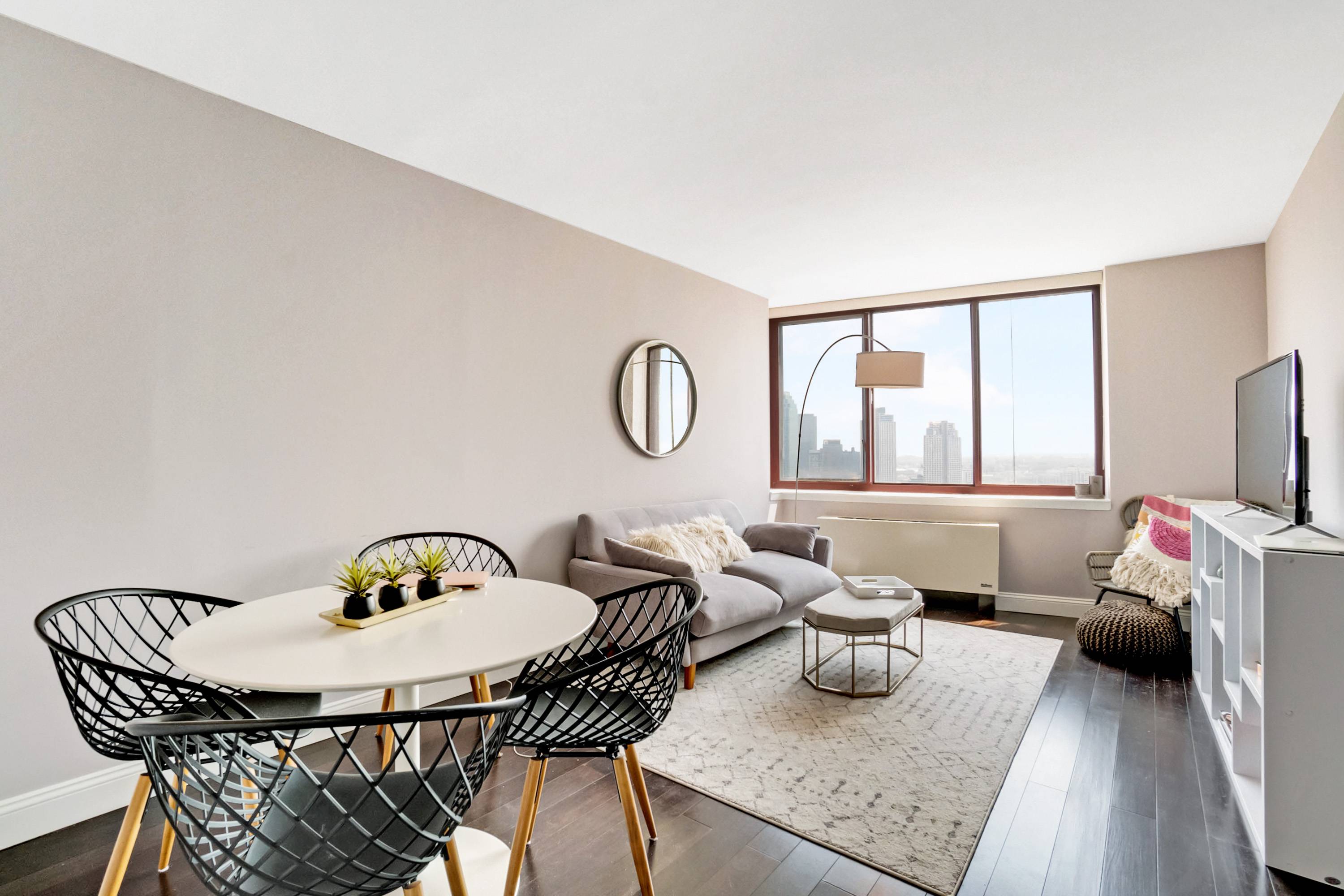 Warm sunlight streams into this east facing large renovated 1 bedroom apartment with views of Queens and the Brooklyn skyline.