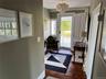 Entryway featuring wood-type flooring and baseboards