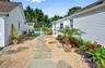 View of yard featuring a fenced in pool and a patio