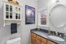 Half bath featuring vanity and toilet