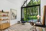 Second floor bedroom with floor to ceiling windows and outdoor access to balcony with water views