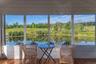 Interior of screened pond porch, with view