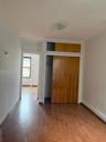 Unfurnished bedroom with a closet and wood finished floors