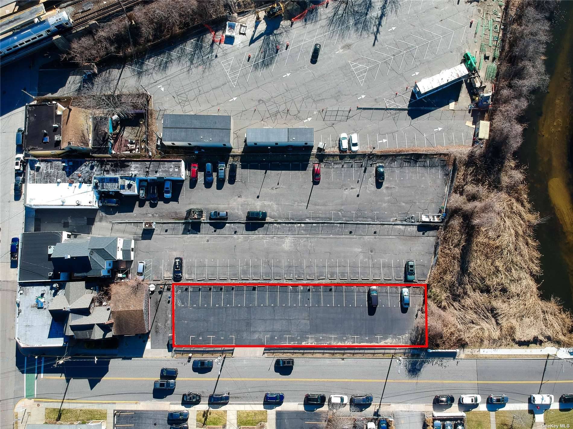 Opportunity Knocks. Paved Residential Commuter Parking lot with 30 spaces next to Babylon Train Station.