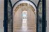 Arched Iron doors welcome you to Palazzo Sul Mare! Opens to water views and a gallery corridor designed for art display and dramatic transitions bet