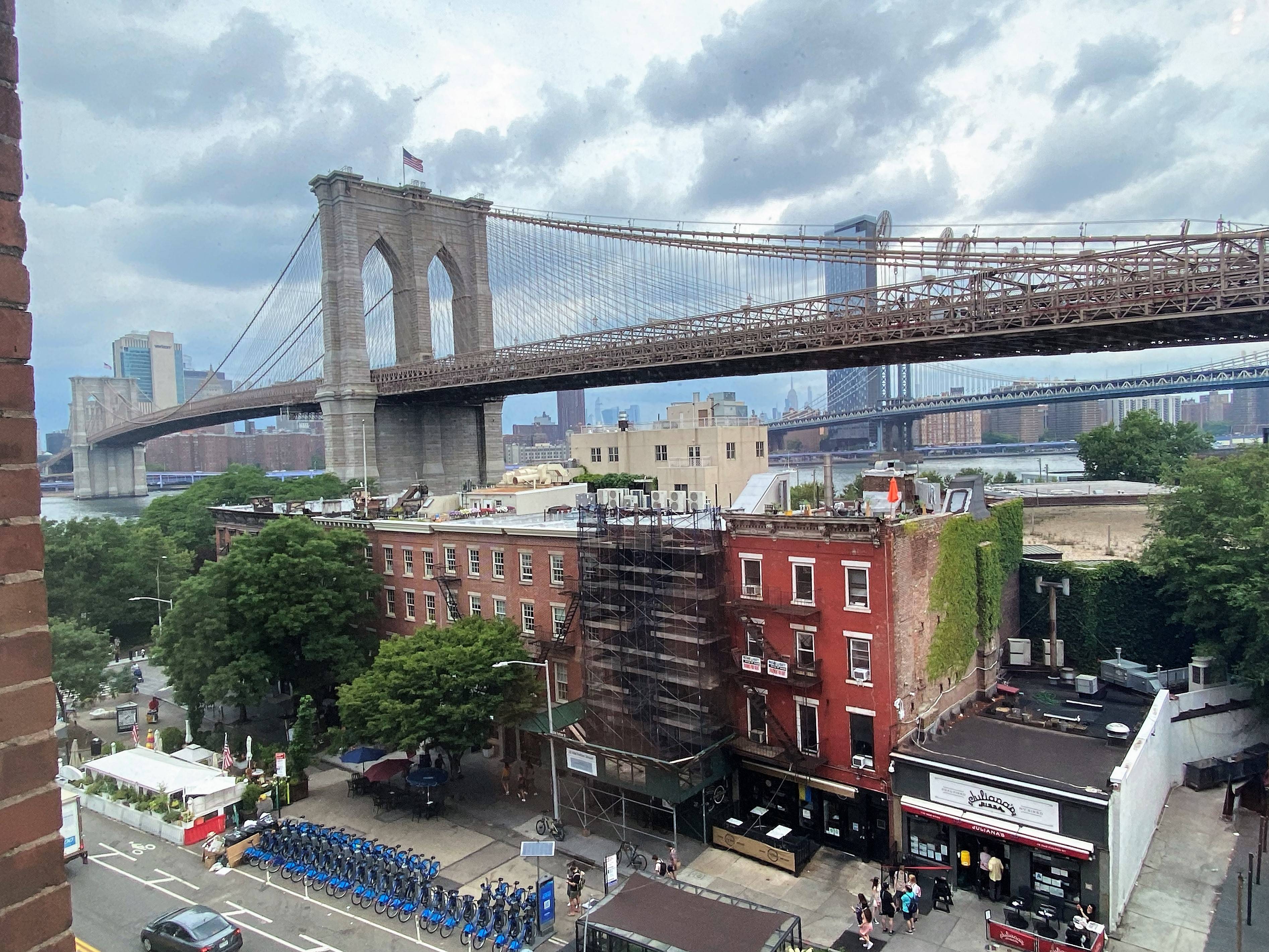 Steps away from Brooklyn Bridge Park, a visit to this truly unique loft home in DUMBO starts with a walk across the 5th floor private bridge across the building's open ...