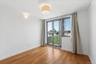 Unfurnished room with light wood-type flooring and a city view