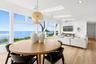 Dining space featuring a skylight, light wood-style floors, recessed lighting, and ceiling fan