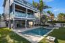Covered ground level patio with direct access to the beach!