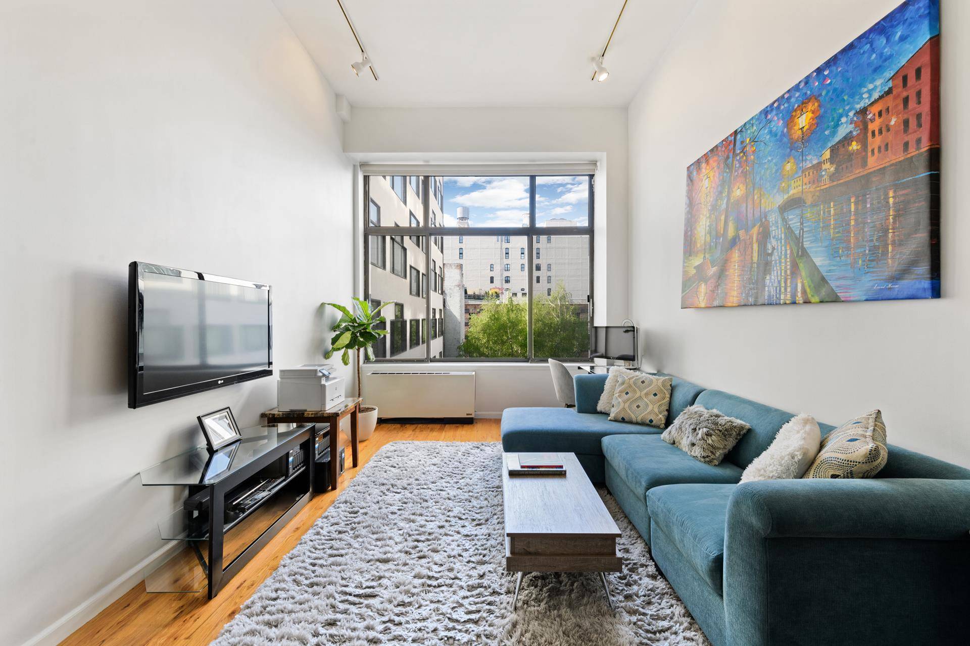 Sun soaked loft with courtyard views in full service Noho coop !