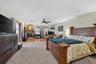 Spacious Primary Suite with Walk-In Closet, Fireplace & Direct Access to the Lanai and Swimming Pool