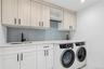 Laundry room with cabinet space, washing machine and clothes dryer, and recessed lighting