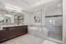 Spa-inspired primary ensuite bath. Large walk-in shower and soaking tub.