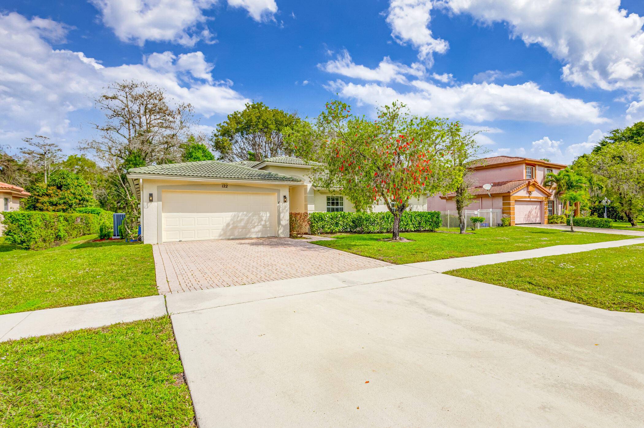 Welcome to 122 Chestnut Circle, Royal Palm Beach an exquisite single family retreat nestled in a tranquil community with a modest 30 monthly HOA fee.