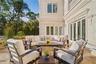 Private patio surrounded by lush landscaping and serene views.