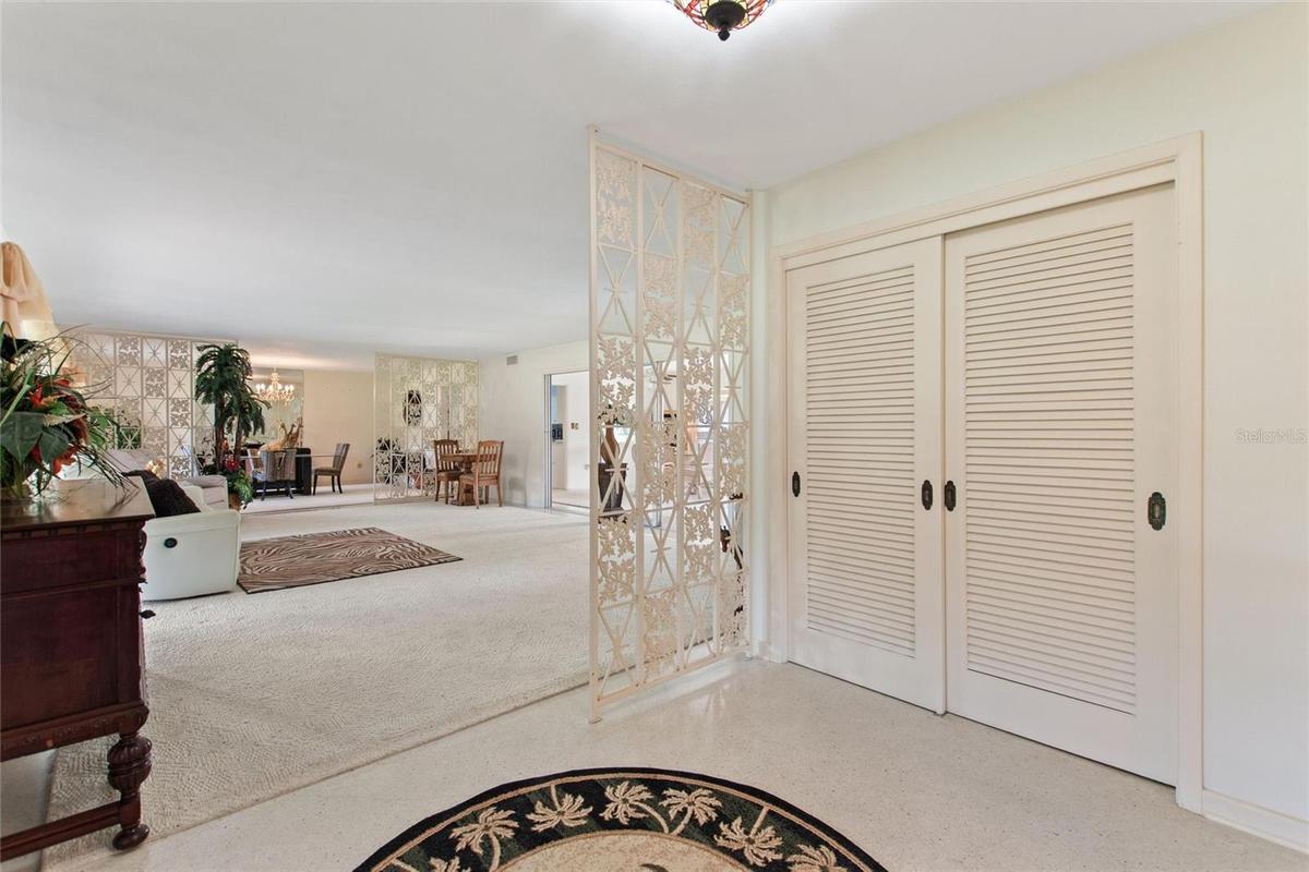 What a beautiful entrance. The double doors open to a storage closet.