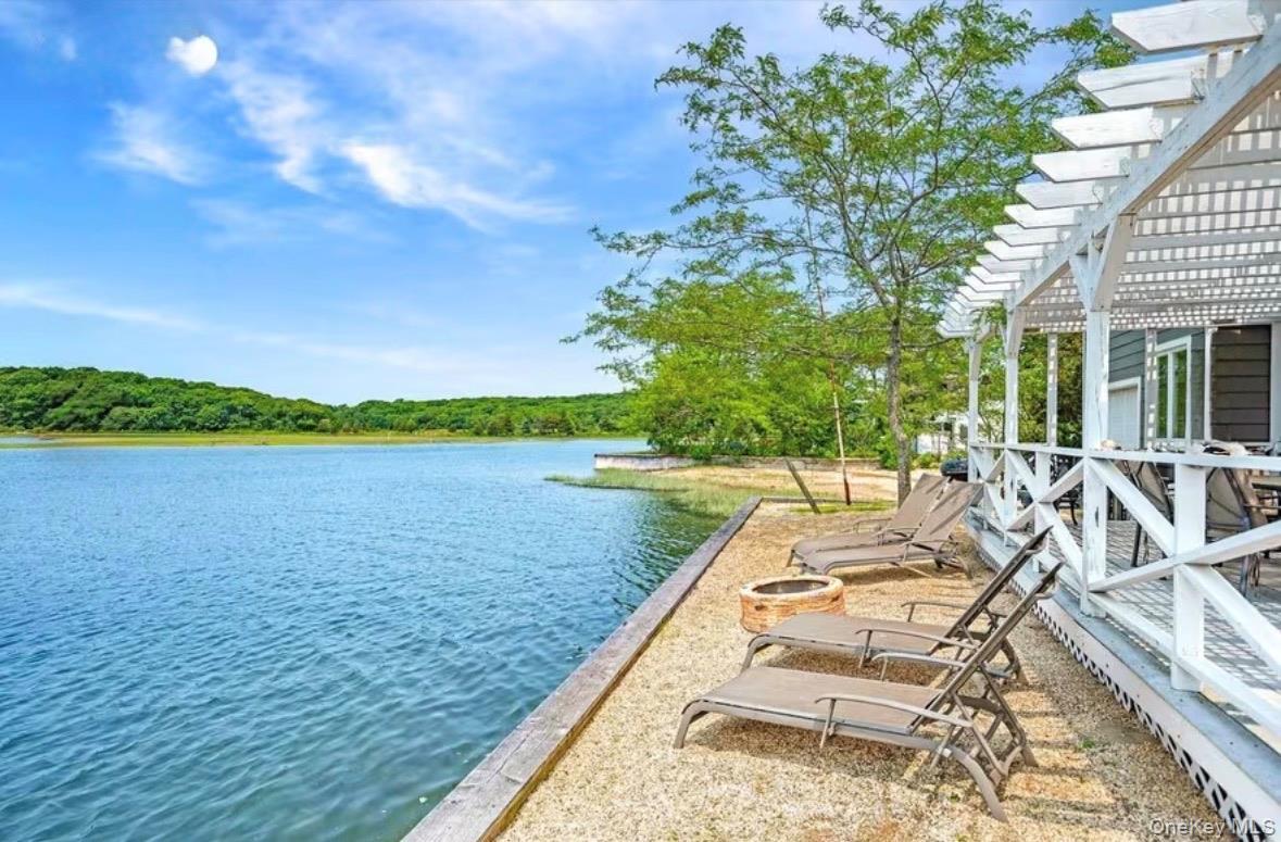 sandy lounge area overlooking the water