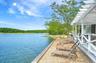 sandy lounge area overlooking the water