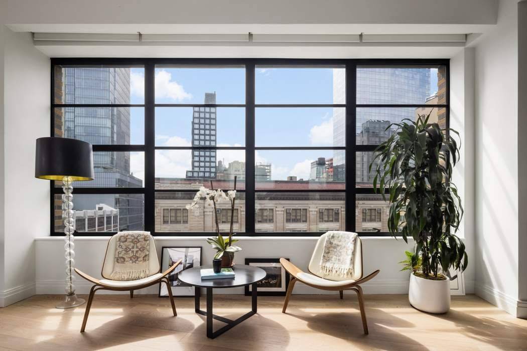 This iconic Cary Tamarkin condominium offers the option to purchase a parking spot in the building's private garage, a true rarity in SoHo.