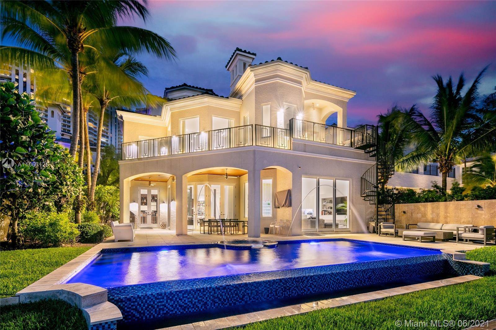 Three story modern masterpiece featuring 6BD 7BA in the exclusive Island Estates gated community.