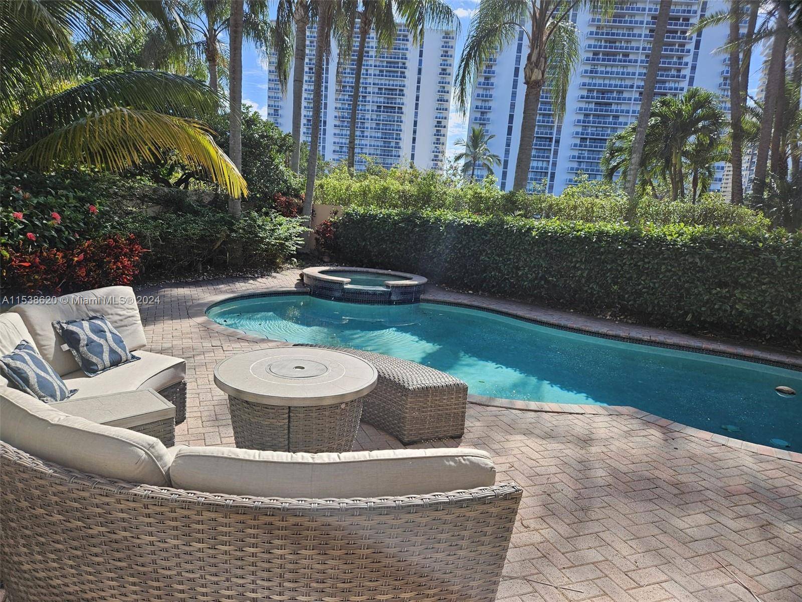 Desirable 2 story single family in Island Way gated community in the heart of Aventura, built along the Waterways Marina.