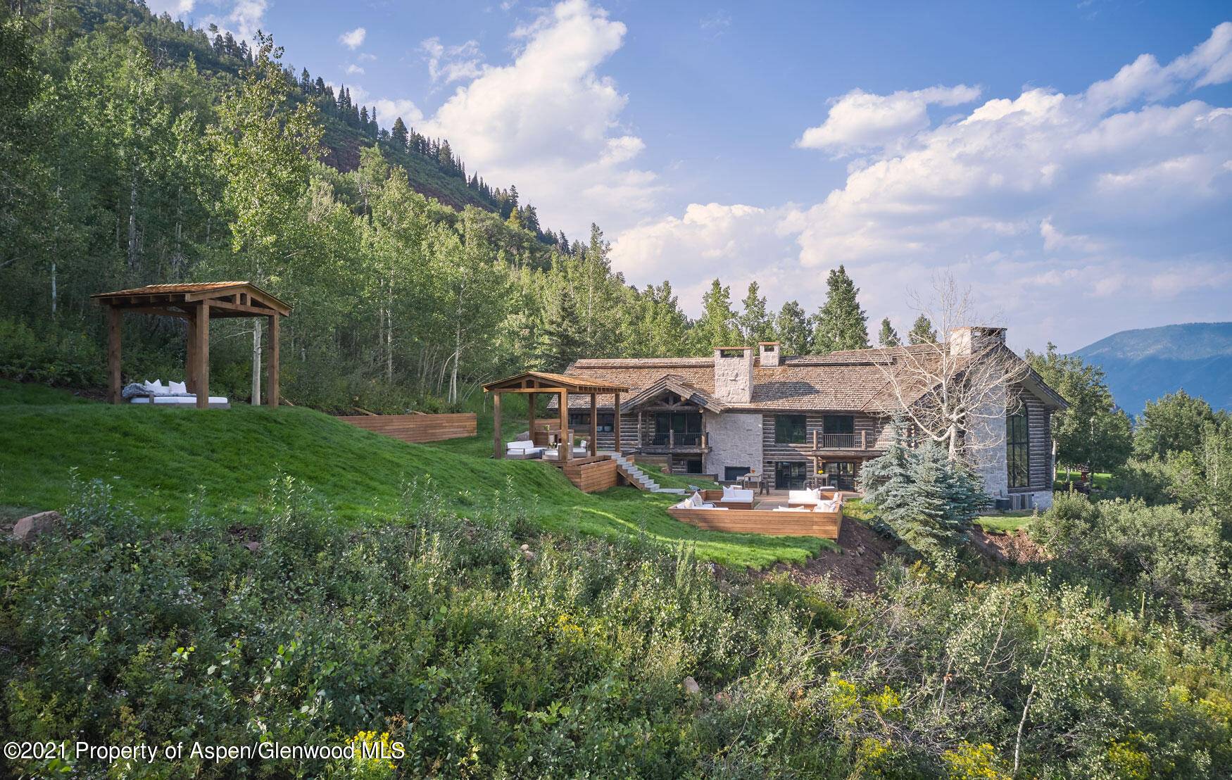Atop Castle Creek dominating the valley in Aspen, Colorado, sits a new family compound.