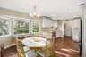 Dining space featuring recessed lighting, dark wood-style floors, and a chandelier