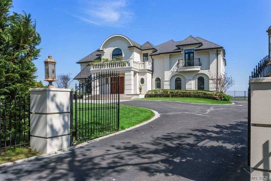 This is a one of a kind custom built French Chateau nestled in Hewlett Neck.