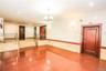 Tiled empty room with recessed lighting, a wainscoted wall, a chandelier, and tile walls