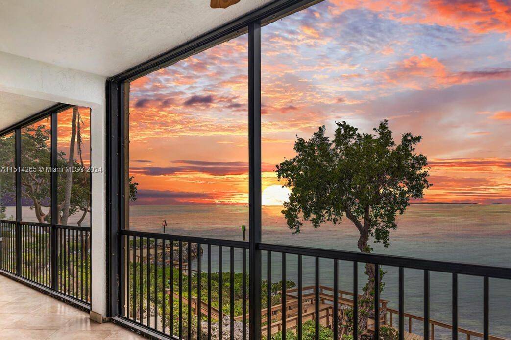 Fall in love with the stunning direct bay views and sunsets from this 2 bed 2 bath condo with an assigned 36 ft boat slip 36' x 12.