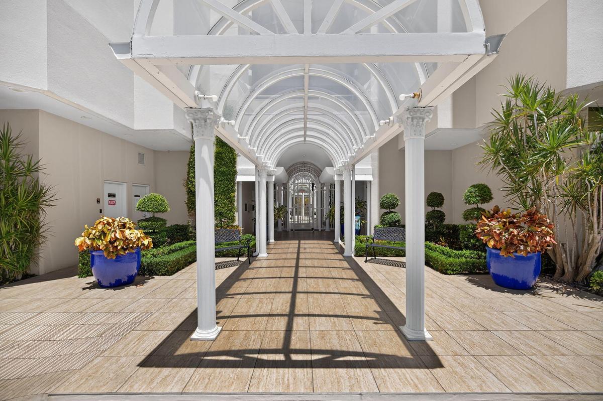 Welcoming main entrance featuring a covered walkway that sets the tone for relaxed coastal living