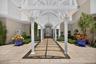 Welcoming main entrance featuring a covered walkway that sets the tone for relaxed coastal living