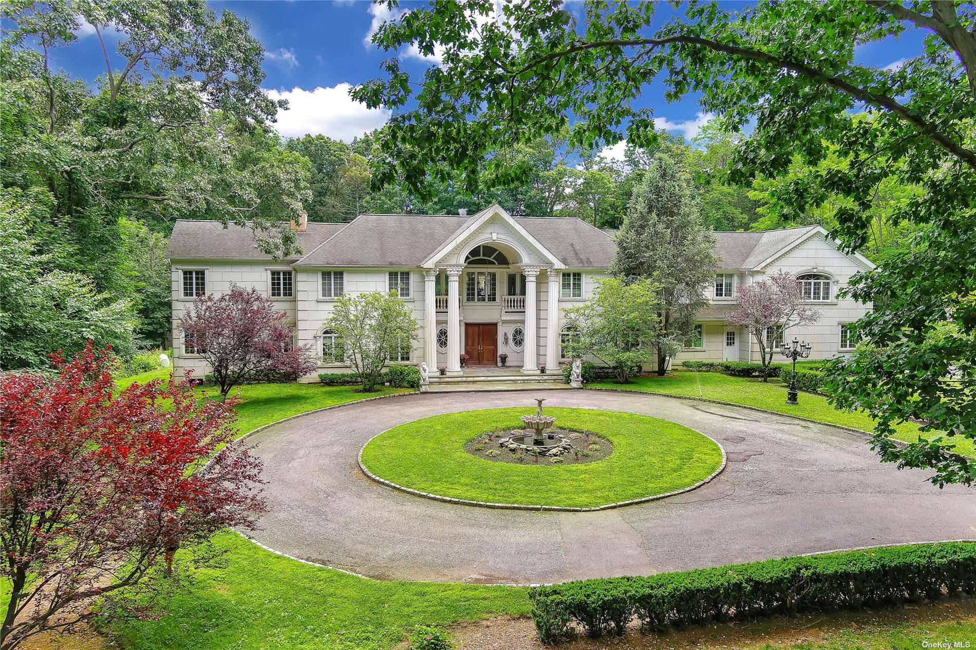 MILL NECK. Incredible Stone and Stucco Gated Colonial, Custom Built and Located on Over 5 Private, Beautiful and Wooded Acres, In the Heart of the Village of Mill Neck.