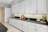 There is endless cabinet and counter space, pantry and a separate laundry room off of the kitchen