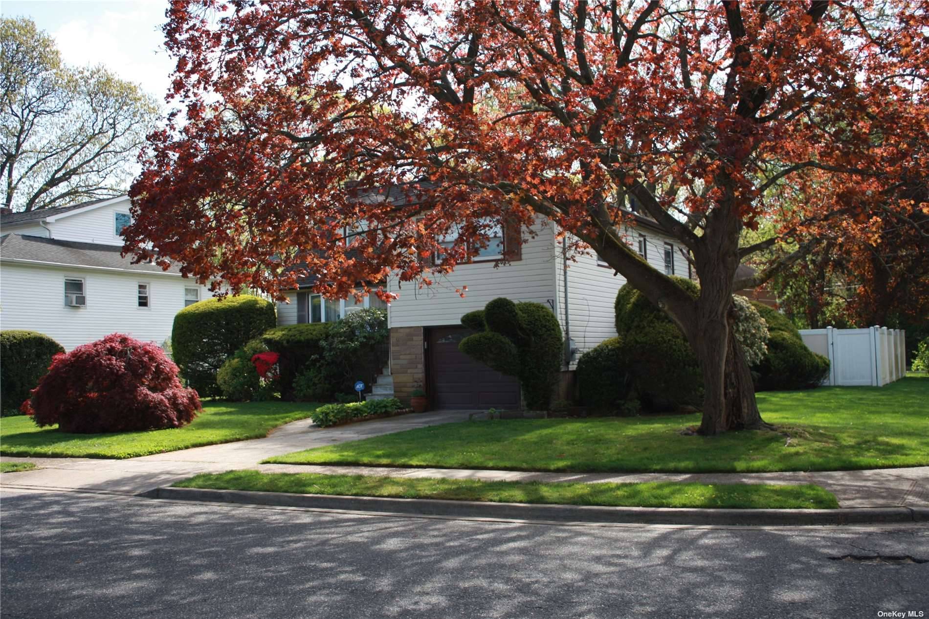 Lovely Split, five levels sitting on a corner lot with manicured lawns.