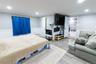 Bedroom with crown molding, wood finished floors, wainscoting, and recessed lighting