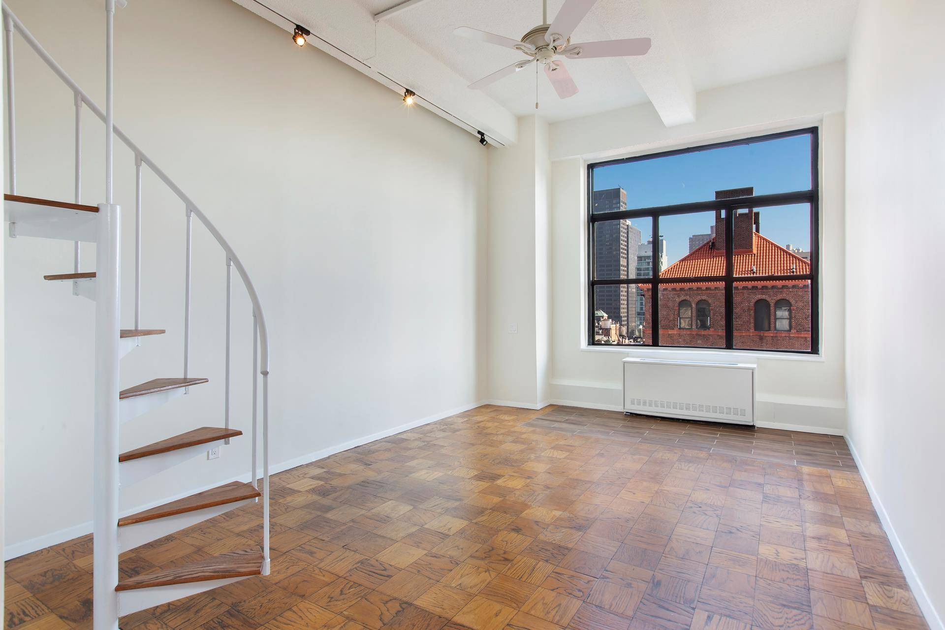 A modern gem at the elegant prewar Murray Hill Plaza, this Top Floor Penthouse studio apartment with a sleeping loft is spacious, airy and beautifully designed.