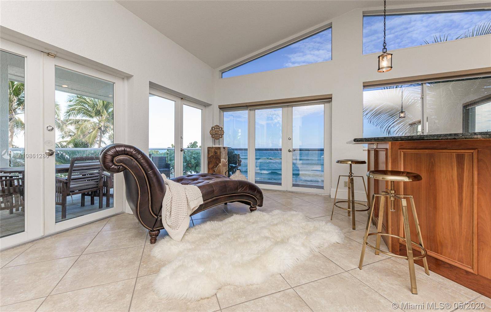 This Spacious Cozy Two Story Beach House with Mesmerizing Panoramic Ocean Views from it's every corner located right on the white sands at the end of the famous Hollywood Boardwalk ...