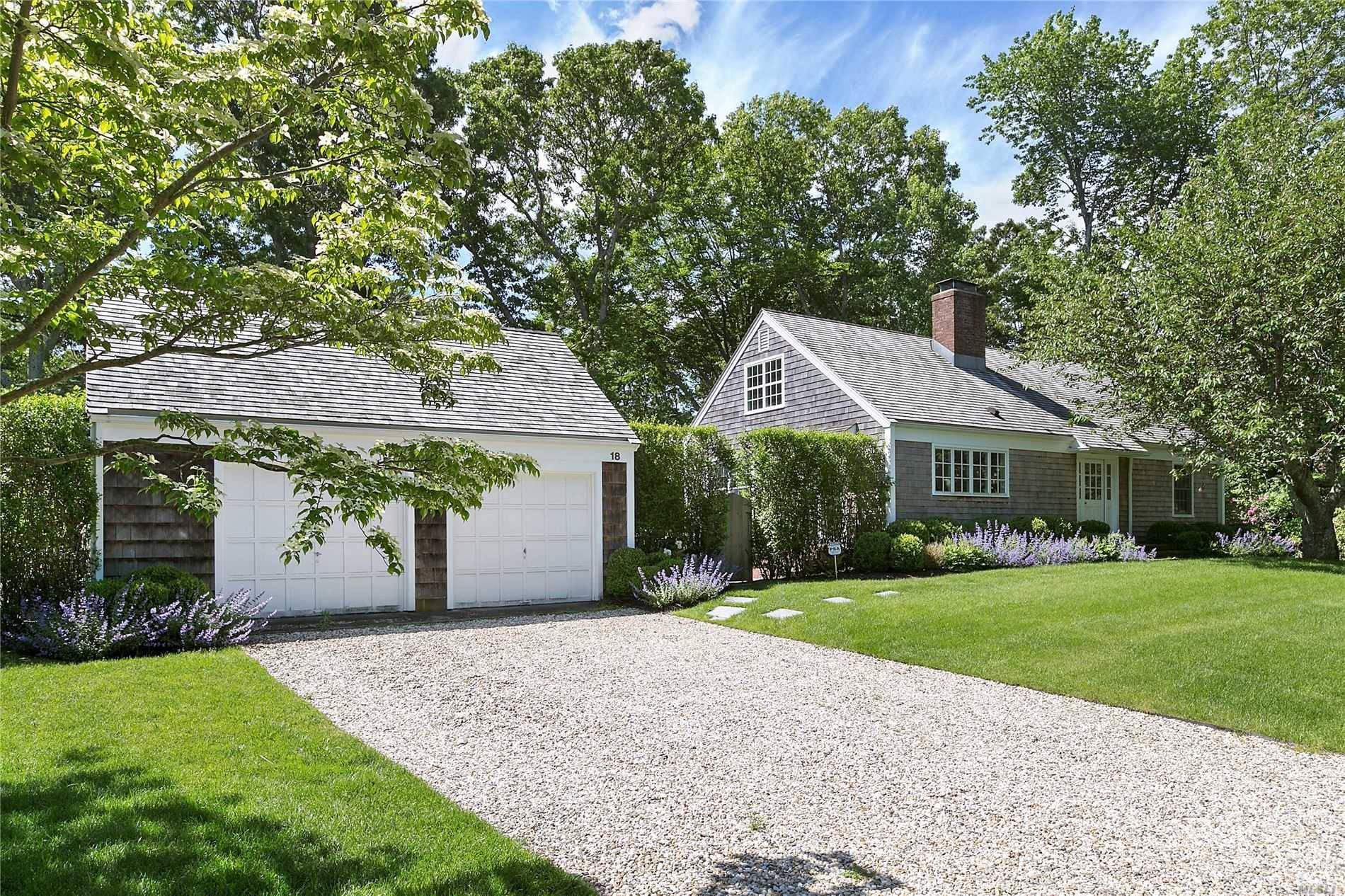 Situated in the highly desirable Redwood community of Sag Harbor Village, fully restored and exceptionally renovated four bedroom, two bath cottage boasts authentic beamed ceilings and wide planked floors.