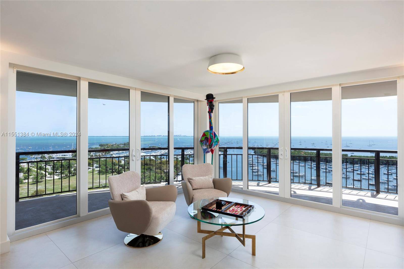 A modern haven in the sky with the most PRICELESS views in all of Coconut Grove.