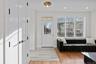 Foyer entrance with light wood-style flooring and recessed lighting