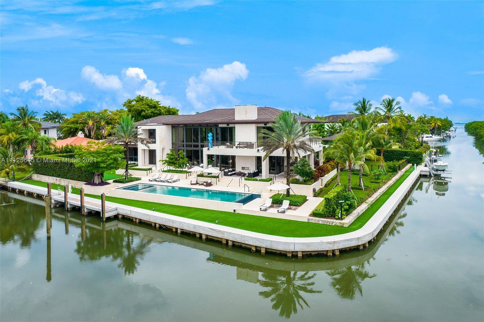 Dream Home with 10, 061 SF on a Corner Lot with over 355 of Waterfront in the Exclusive Gated Community of Old Cutler Bay.