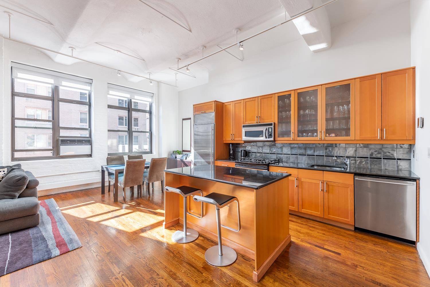 Dramatic renovated pre war loft beauty featuring 12' barrel vaulted ceilings, oversized thermopane windows, hardwood flooring and exposed brick.