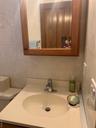 Bathroom featuring vanity and tile walls
