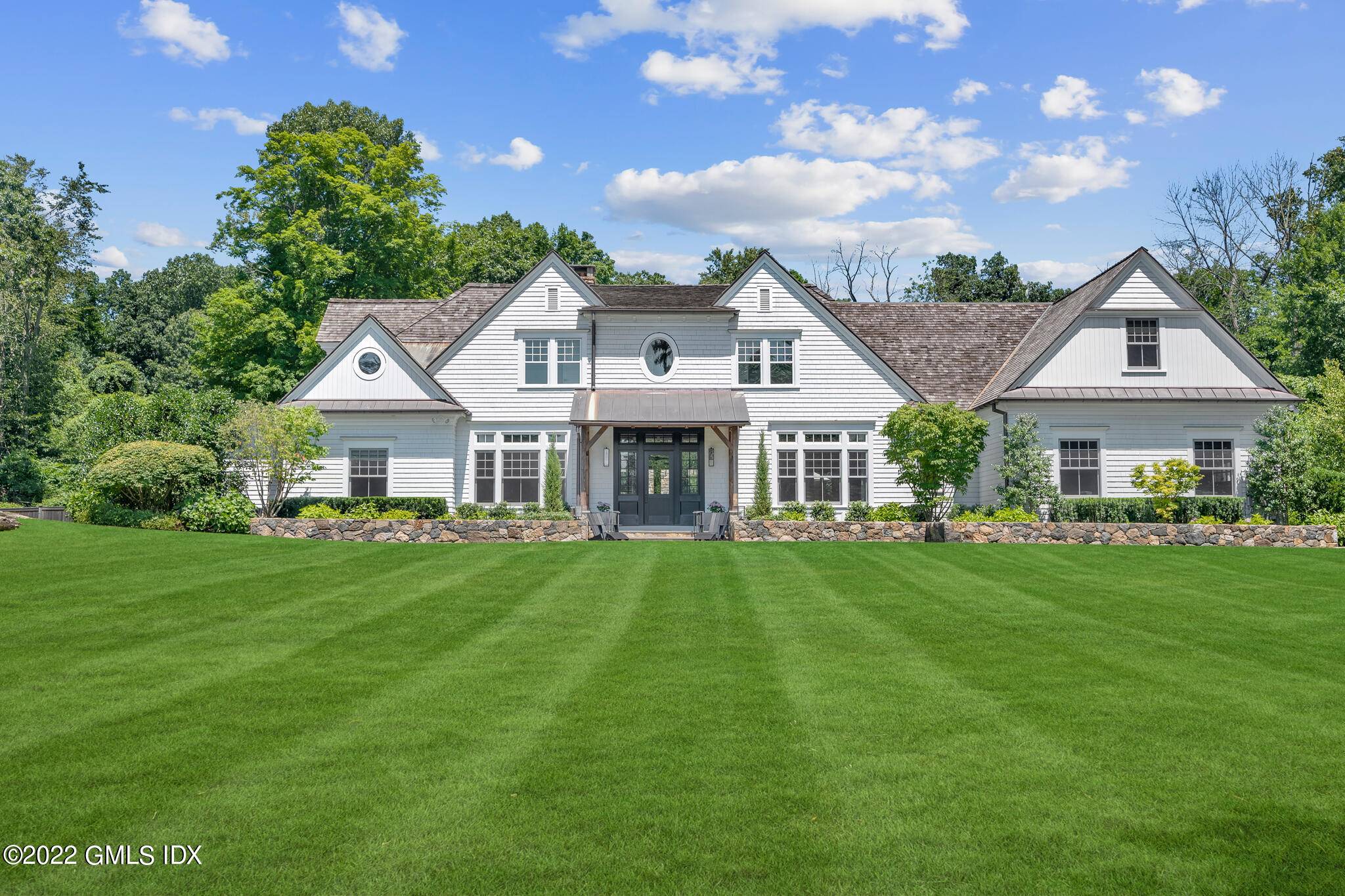 Stunning renovation combines classic farmhouse features with modern chic sophistication.