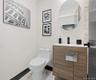Half bathroom with vanity and toilet
