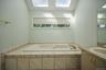 Enjoy bathing in the Jacuzzi tub with two skylights above