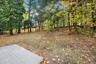 Peaceful and private, the spacious backyard offers a natural wooded backdrop — perfect for quiet mornings, evening fires, or simply enjoying the chang