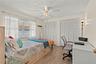 Comfortable and spacious third bedroom featuring ample natural light, generous closet space, and flexibility to accommodate family, guests, or a home