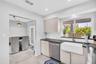 Kitchen Overlooking Backyard Oasis